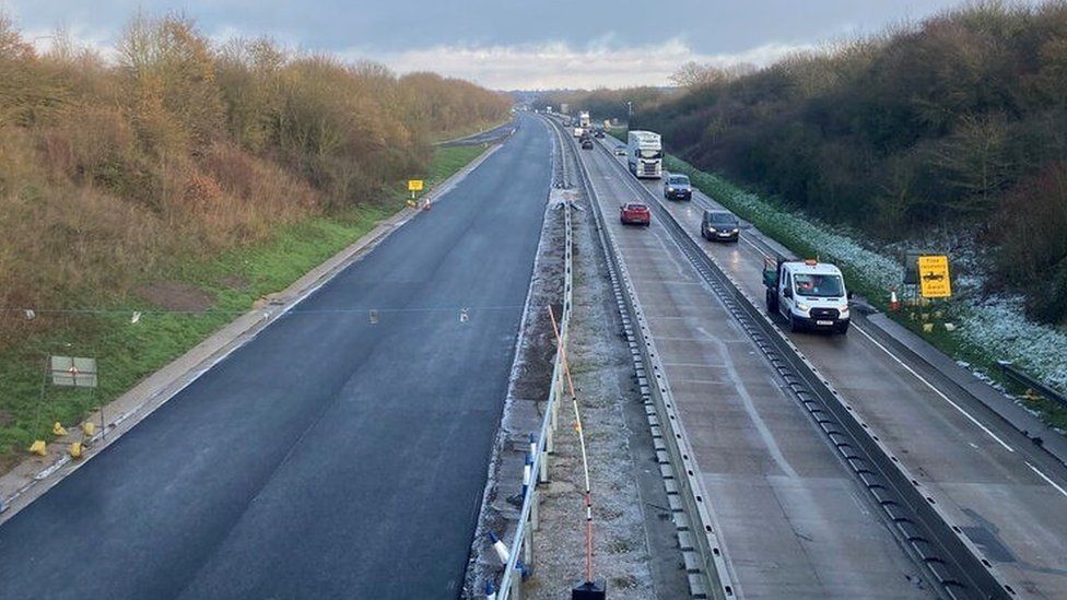 The A11, with one side of the road freshly resurfaced