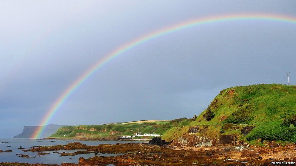 A rainbow by the coast