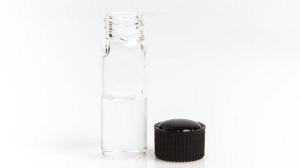 A bottle containing a clear liquid