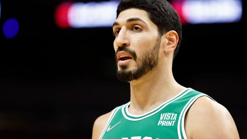 Enes Kanter #11 of the Boston Celtics looks on against the Miami Heat during a preseason game at FTX Arena on October 15