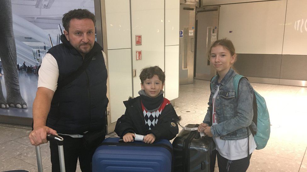 Daniel Maloney and children Freddie and Isabella at Heathrow airport