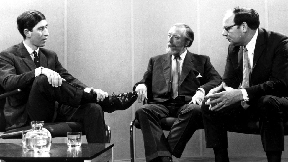 In 1969, Michelmore (right) interviewed Prince Charles) alongside the BBC's Brian Connell (centre)