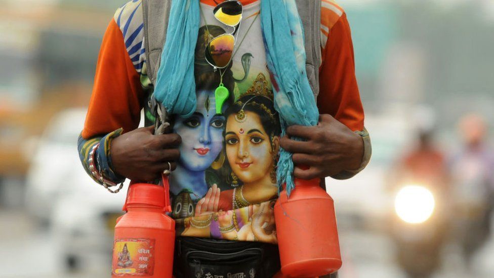 A Kanwariya seen wearing a t-shirt with the Hindu god Shiva printed on it.