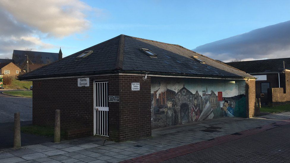 A disused public toilet decorated with a colourful mural in North Street, Dowlais