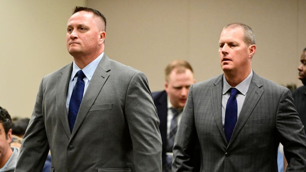 Paramedics Jeremy Cooper, left, and Peter Cichuniec, right, at an arraignment in the Adams County district court at the Adams County Justice Center January 20, 2023.