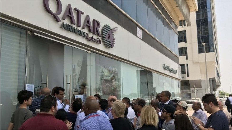 Crowd outside Qatar Airways office