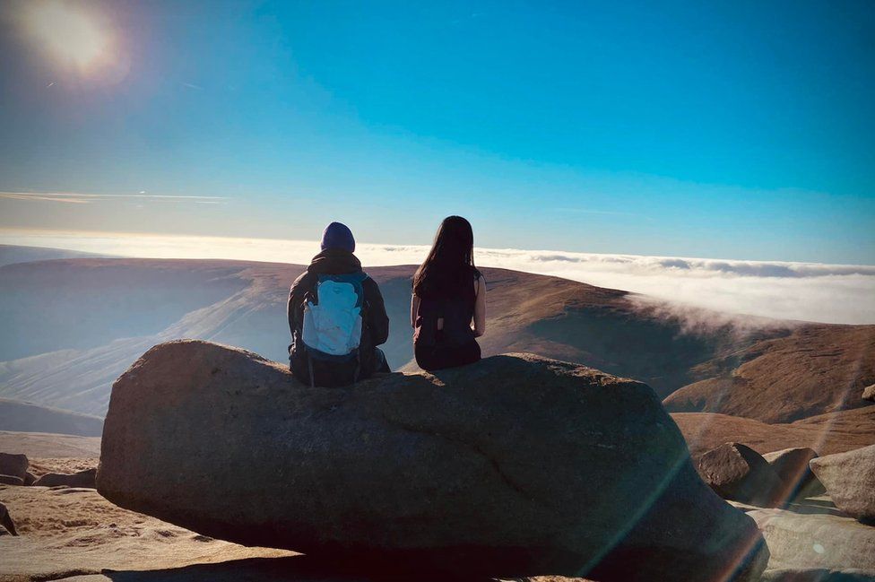 Hayley Pearson and her brother with a cloud inversion at Kinder Scout