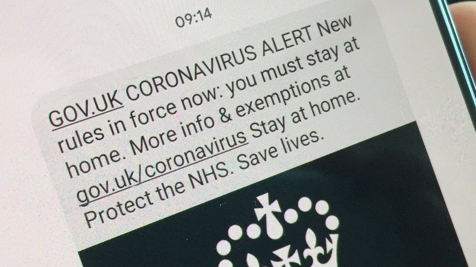 Text message on a smartphone that says Coronavirus Alert