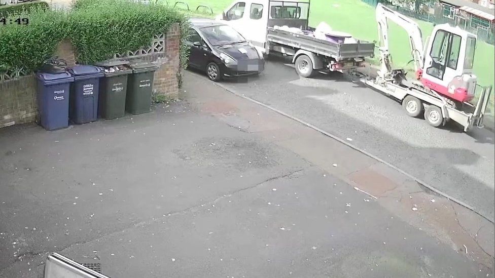 Jacques pulling up outside the shop with the tipper truck