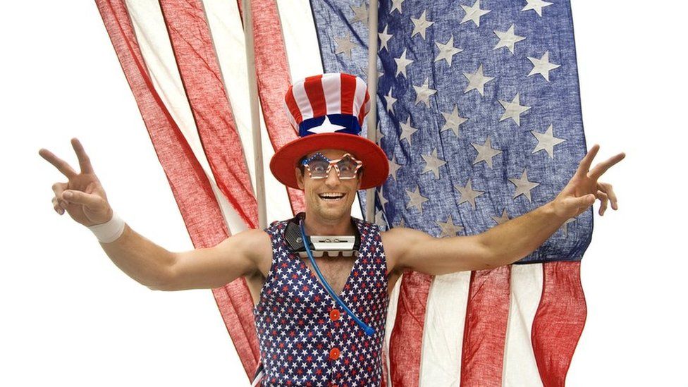 A stilt walker performs at a 4 July parade in California
