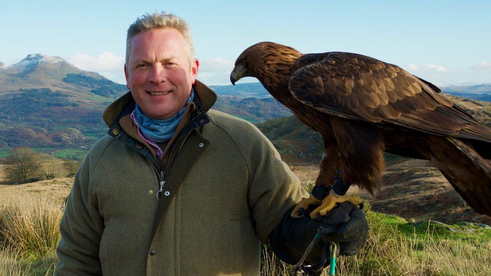 Countryfile Winter Diaries presenter with a golden eagle.