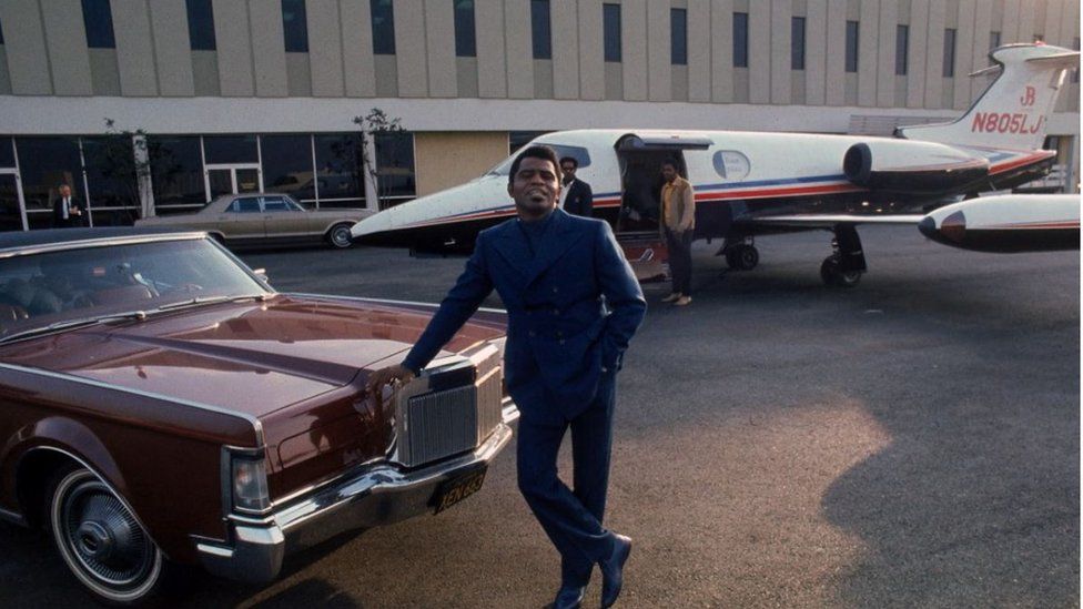 James Brown poses with his Learjet at Los Angeles International Airport in 1969