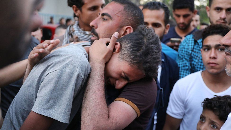 A teenager cries as he learns that his brother was killed today during protests at the border fence with Israel on May 14, 2018 in Gaza City, Gaza