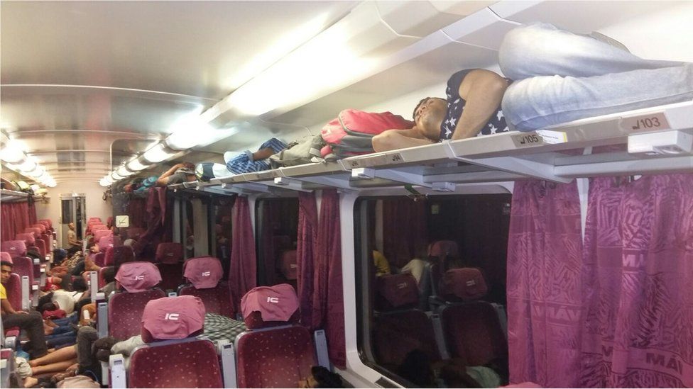 People sleep on board train stuck at Bicske, Hungary, overnight 3/4 September 2015