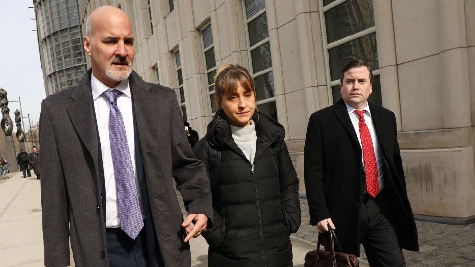Actress Allison Mack leaves the Brooklyn Federal Courthouse with her lawyers in 2019
