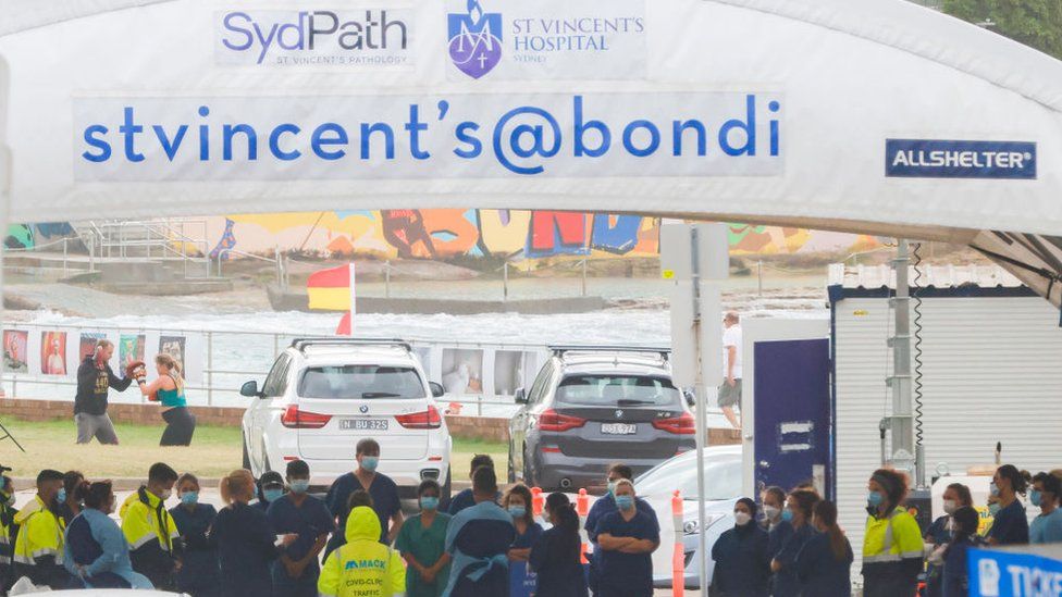 Health workers congregate ahead of the opening of the SydPath COVID-19 testing clinic at Bondi Beach on December 28, 2021 in Sydney, Australia