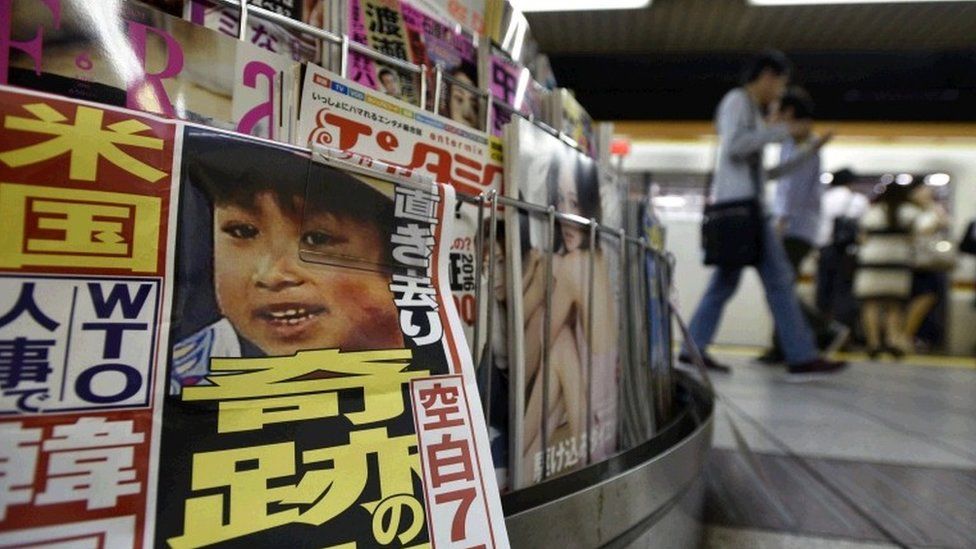 Yamato Tanooka is pictured on an evening newspaper at a subway station kiosk in Tokyo, Japan, 03 June 2016.