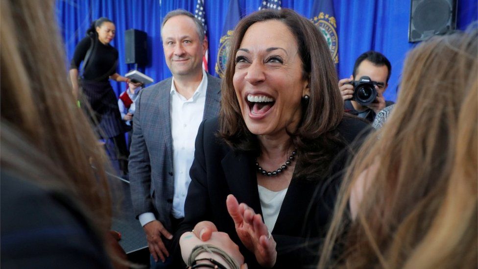 US Senator Kamala Harris, with her husband Douglas Emhoff at her side, greets primary voters in April 23, 2019