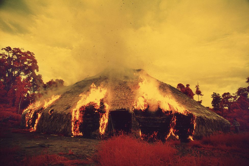 The Yanomami burn down their malocas when they migrate, if they want to get rid of a plague or if an important leader dies. Taken with infrared film in 1976