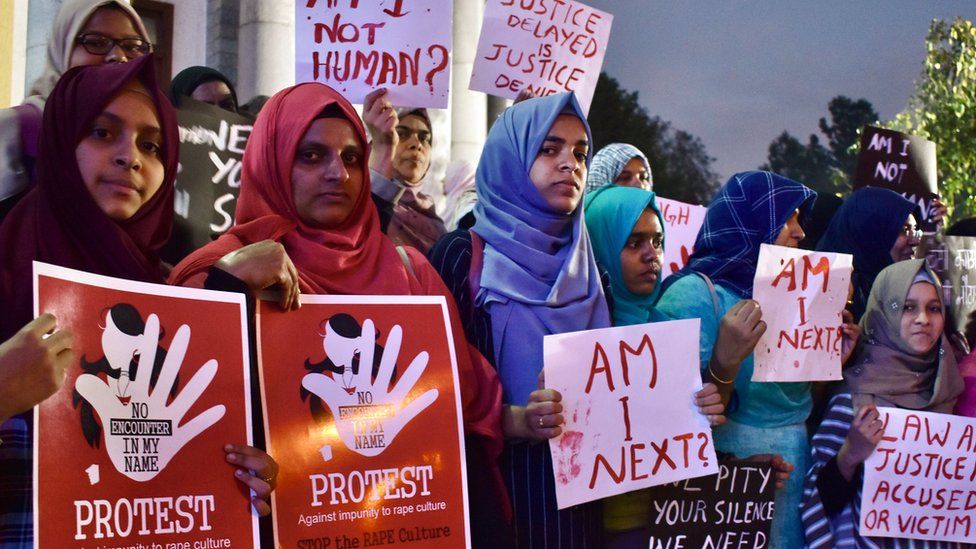 Activists from various women's rights organisations hold placards as they protest against sexual harassment, rapes and murders of women across the country urging the government to help uphold the women's rights, during a demonstration in Bangalore on December 11, 2019.