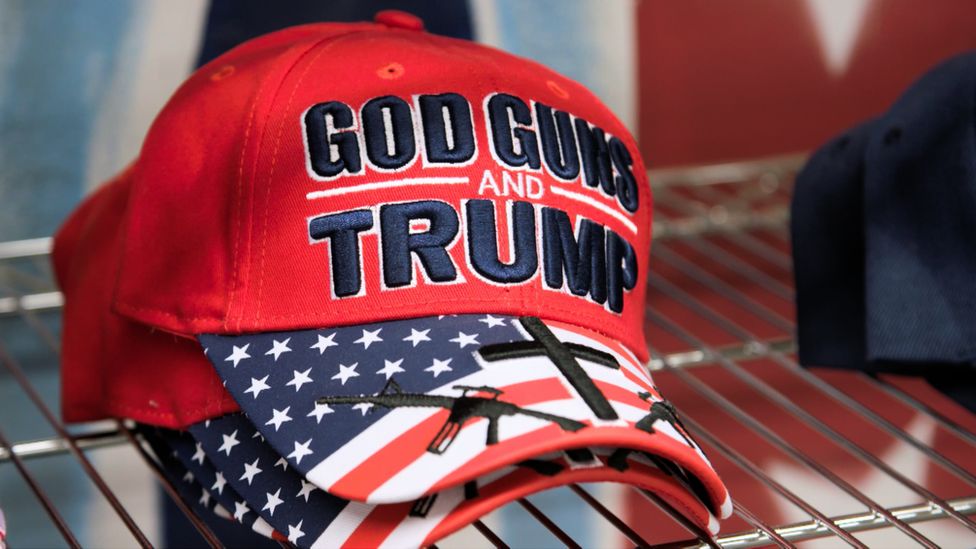Baseball cap that says God, guns, Trump