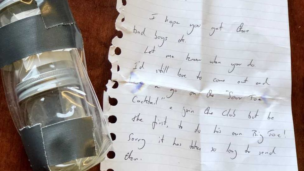 A handwritten note and packaged toes from Nick Griffiths