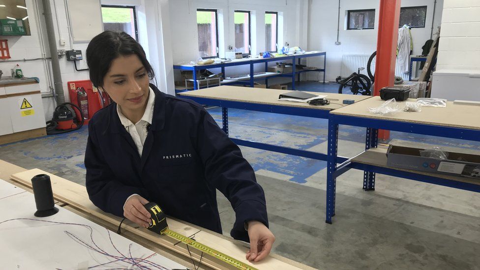 Khadijah Ismail measuring harness for wing section of drone