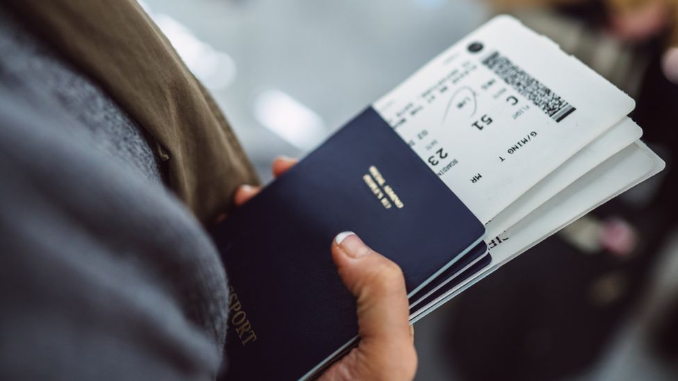 Woman holding passport