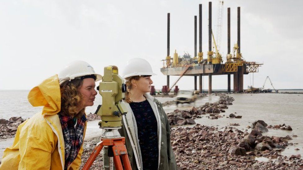 Women do measurements at bridge site
