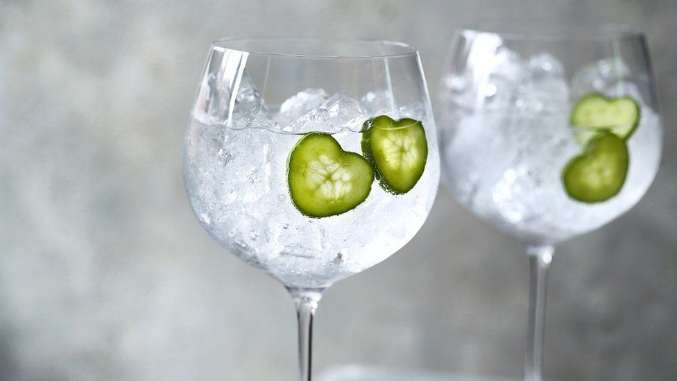 Heart-shaped cucumber slices in drink