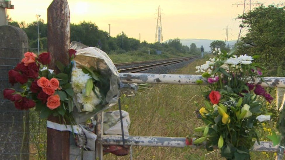 Two bouquets of flowers placed at the scene