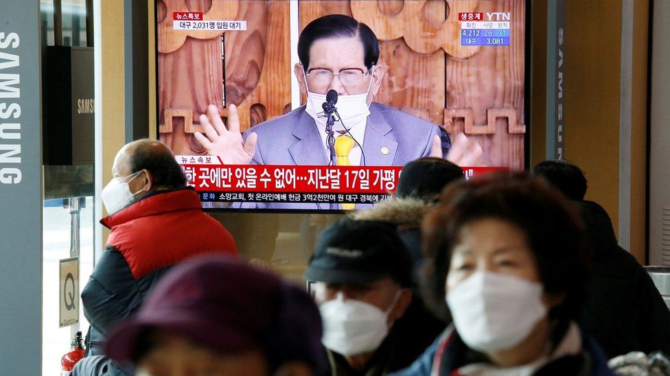 People watch a TV broadcasting a news report on a news conference held by Lee Man-hee, founder of the Shincheonji Church of Jesus the Temple of the Tabernacle of the Testimony, in Seoul, South Korea, March 2, 2020