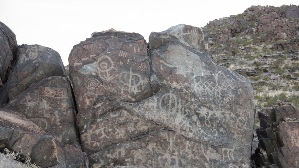 Petroglyphs on a rock face in Samalayuca