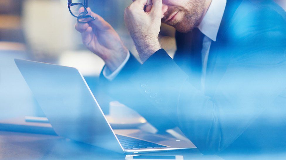 Businessman with computer problems