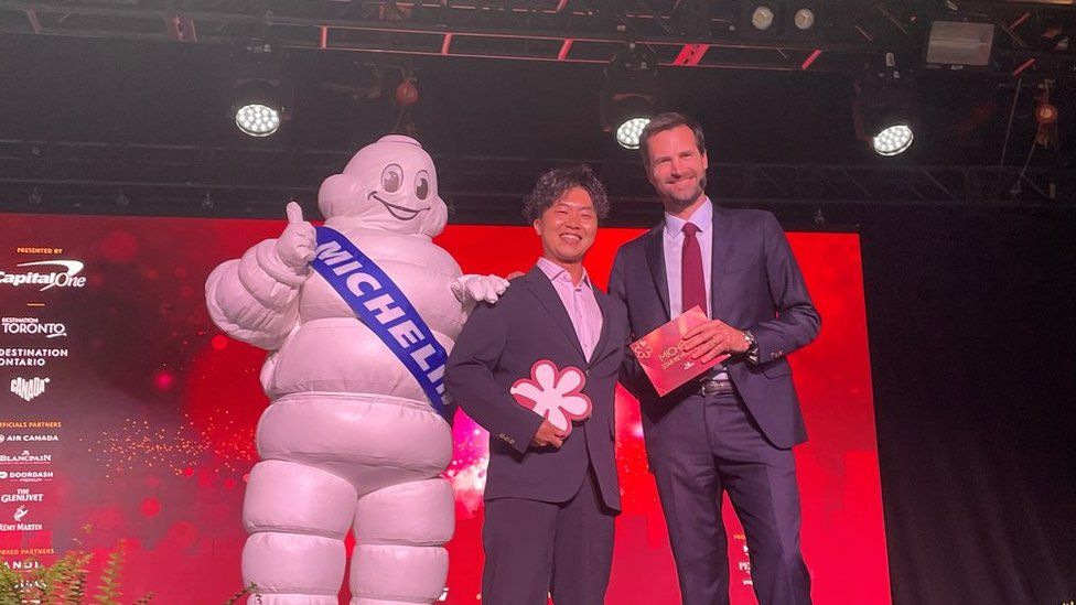 Chef Ryusuke Nakagawa from Toronto Japanese restaurant Aburi Hana posing with the Michelin man.