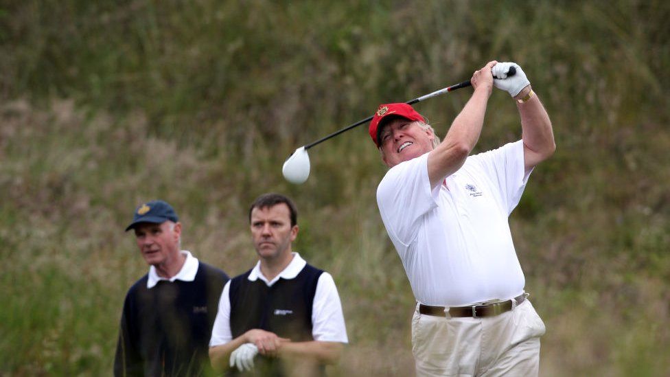 Donald Trump tees off from the third after the opening of The Trump International Golf Links Course on July 10, 2012 in Balmedie, Scotland.