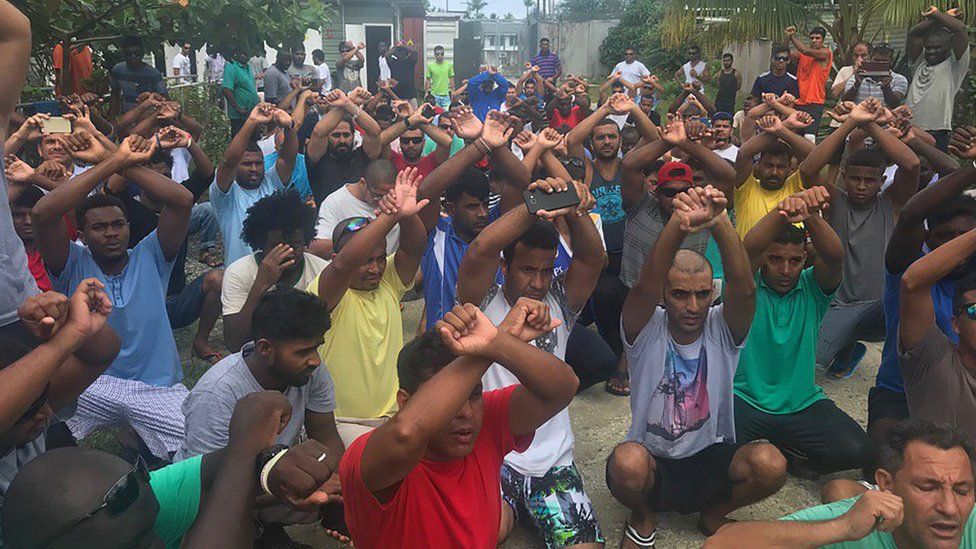 A picture handed out by Nick McKim, Australian Greens Senator for Tasmania, shows refugees gesturing inside the Manus detention camp in Papua New Guinea on the day of the camp's expected closure, 31 October 2017