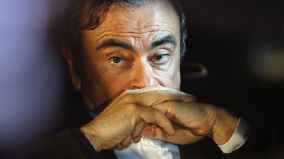 Carlos Ghosn sits in a car after leaving his lawyers office in Tokyo, Japan, 6 March 2019