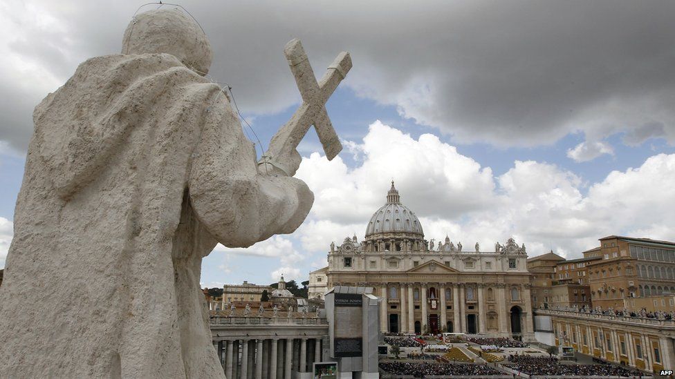 A statue overlooks St Peter's Square in the Vatican