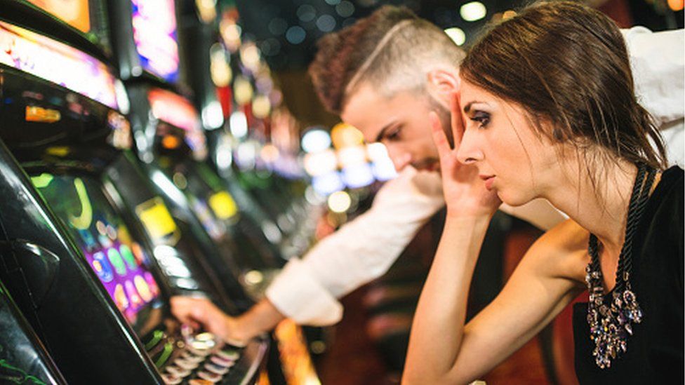 Man and woman gambling