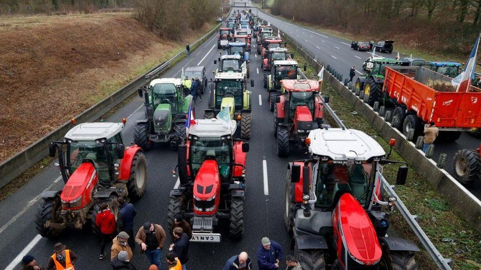 French farmers use their tractors to block the A1 highway in Chamant, near Paris, France, on 26 January 2024