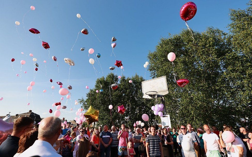 Mourners release balloons at Chloe Mitchell vigil in Ballymena