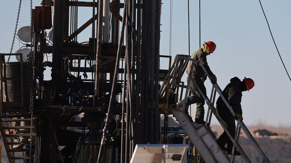 Workers place pipe into the ground on an oil drilling rig set up in the Permian Basin oil field on March 12, 2022 in Midland, Texas. President Joe Biden imposed a ban on Russian oil, the world’s third-largest oil producer, which may mean that oil producers in the Permian Basin will need to pump more oil to meet demand. The Permian Basin is the largest petroleum-producing basin in the United States.