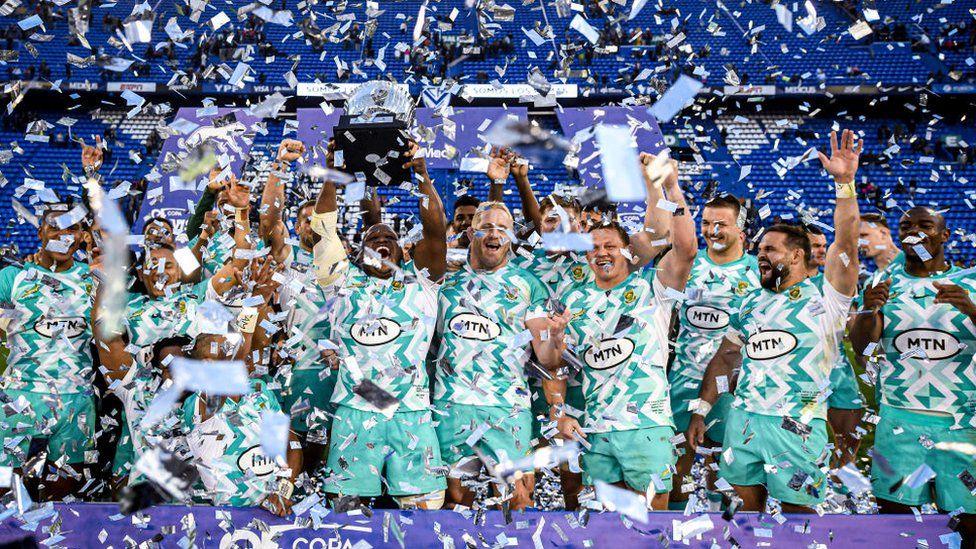 South Africa rugby team holding trophy with confetti all around, 5 August 2023