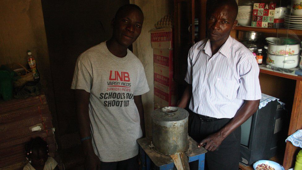 Taxi driver Grivin Phiri (right) and his 19-year-old son Rabson