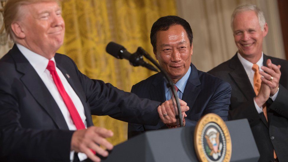 Donald Trump shakes hands with Terry Gou in July after announcing Foxconn's investment