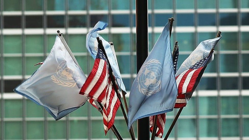 The United Nations flag flies with American flags
