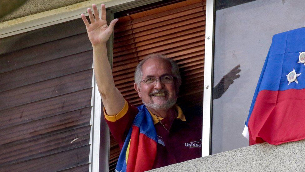 Metropolitan mayor Antonio Ledezma waves from the window of his resident in Caracas, Venezuela, 16 July 2017