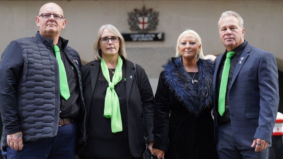 Father Tim Dunn, stepmother Tracey Dunn, mother Charlotte Charles and stepfather Bruce Charles pose outside the Old Bailey in London in December 2022