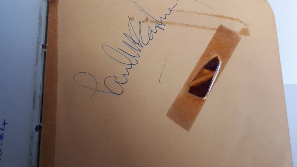 Paul McCartney's signature and broken plectrum